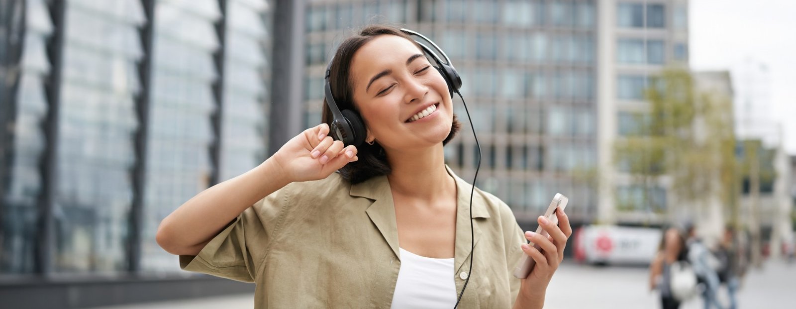 Happy woman listening to music